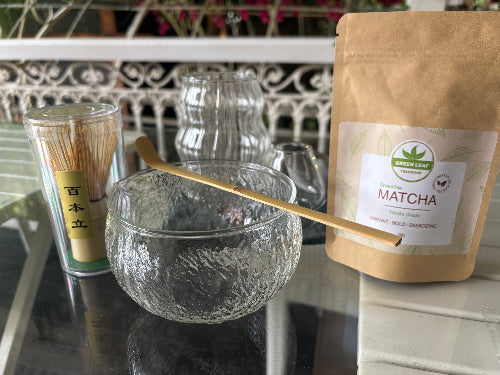 Matcha tea set with whisk, spoon, matcha powder, matcha tin and  glass accessories