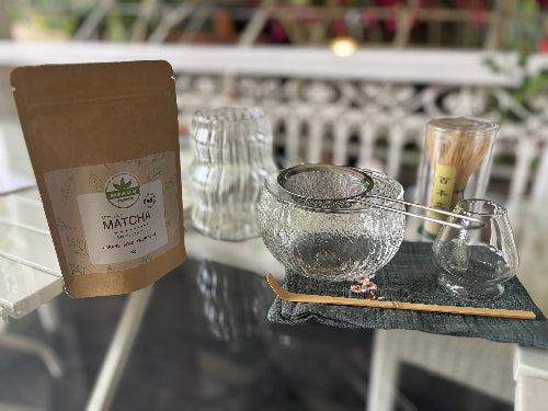 Matcha powder with tea-making tools o